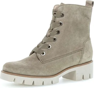 A single grey suede biker boot with laces and a thick white sole, shown from a side-diagonal angle on a white background.