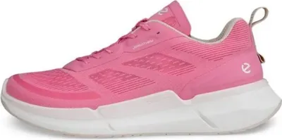 A side view of a pink and white low-top sneaker.
