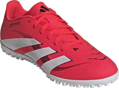 A red Adidas Predator Club TF M football boot is shown against a white background.