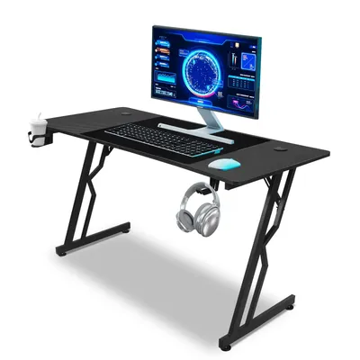 A black gaming desk with a computer monitor, keyboard, mouse, headphones, and a cup holder.