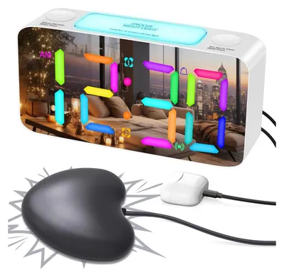 A digital alarm clock with a vibrating pad, displayed in a bedroom setting with a city view.