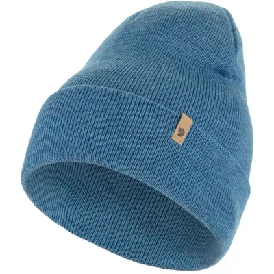 A close-up studio shot of a blue knit hat.
