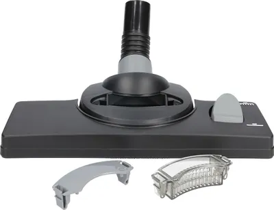 A vacuum cleaner floor nozzle with two small accessories displayed in front of it, all on a white background.