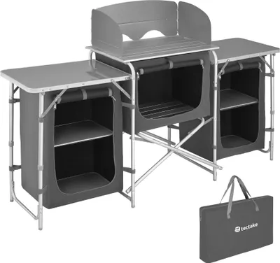 A camping kitchen unit and its carrying bag are displayed against a white background.