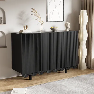 A modern living room with a black sideboard, a floor lamp, and artwork.