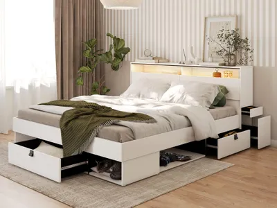A bedroom scene featuring a white bed with integrated storage and LED lighting.