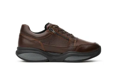 A single brown leather sneaker is shown against a white background.