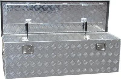 An open aluminum toolbox with a diamond plate pattern.
