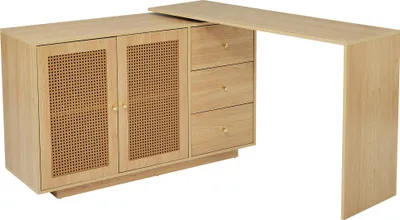 A light wood L-shaped desk with cane doors and drawers against a white background.