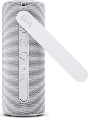 A white Bluetooth speaker with a white carrying strap attached.