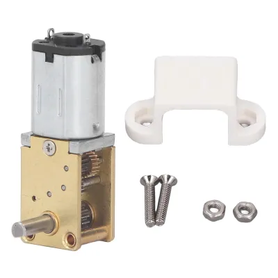 A product shot of a geared DC motor with its accessories, laid out on a white background.