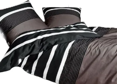 A close-up view of a bedding set with pillows and a duvet cover.