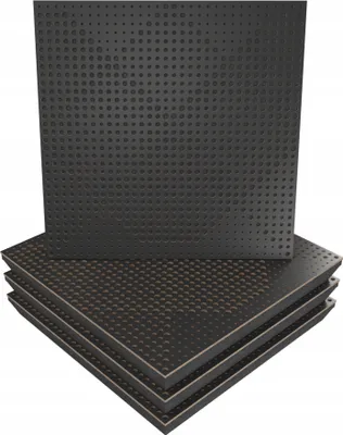 A stack of black acoustic wall panels with a perforated pattern.