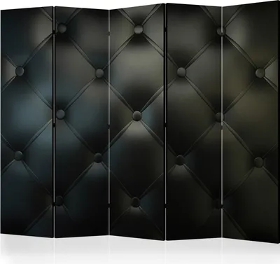 A black tufted room divider is shown against a white background.