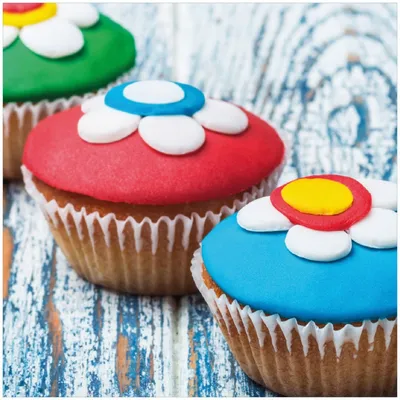Produktbild von Wallario Premium Glasbild, freischwebende Optik, kräftige Farben, Größe 30 x 30 cm Motiv Bunte Muffins - alter Holztisch - Stillleben