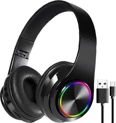 A black pair of over-ear Bluetooth headphones with colorful LED lights on the earcups, shown against a white background. Two charging cables are visible to the right of the headphones.