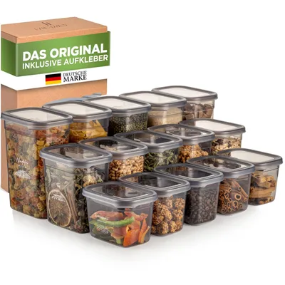 A collection of clear plastic food storage containers filled with various dry goods, arranged in front of a cardboard box with product information.