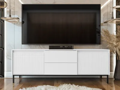 A modern white TV stand with a large black television mounted above it.