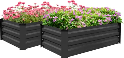 Two black metal raised garden beds filled with pink and purple flowers, set against a white background.