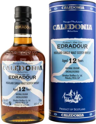 A bottle of Edradour 12 Years Old Caledonia Selection whisky and its cylindrical packaging.