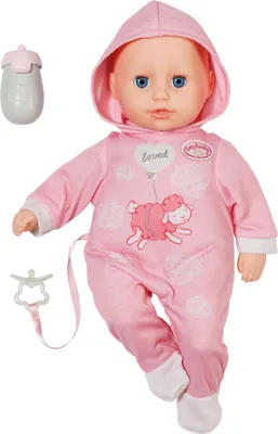 A baby doll wearing a pink hooded outfit with a sheep design, along with a bottle and a pacifier clip.