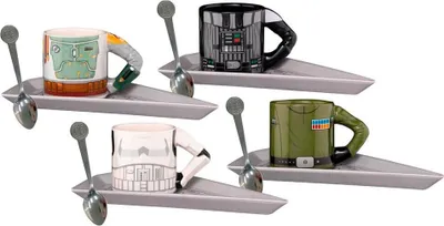 Four Star Wars-themed espresso cups with matching saucers and spoons, arranged in a diagonal pattern.
