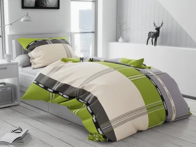 A bedroom scene with a bed made with green and beige plaid bedding.