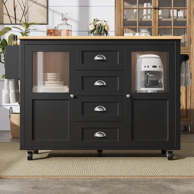 A black kitchen island with a wooden top is shown in a room with a rug and a cabinet in the background.