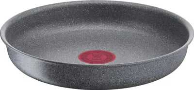 A close-up, straight-on view of a frying pan.