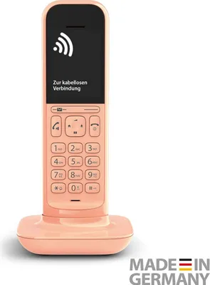 A pink cordless phone and its charging base are shown against a white background. The phone's screen displays a Wi-Fi symbol and German text.