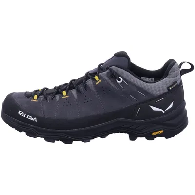 A side view of a single hiking shoe against a white background.