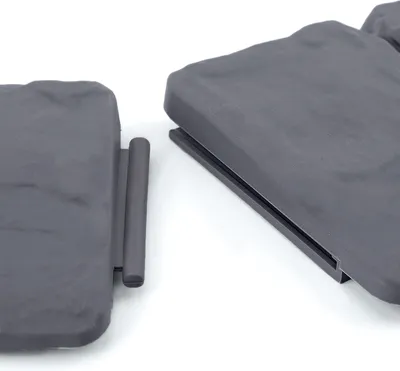 Two pieces of grey plastic garden border are shown from a close-up angle against a white background.