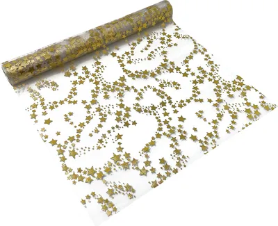 A roll of transparent fabric with gold stars printed on it, unrolled to show the pattern.