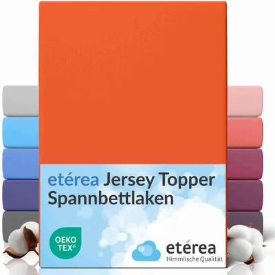 A stack of folded fitted sheets in various colors, with the main product being an orange fitted sheet.