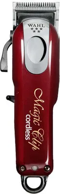 A professional studio shot of a red Wahl Magic Clip cordless hair clipper against a white background.