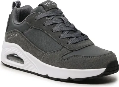 A close-up, studio shot of a single gray sneaker.