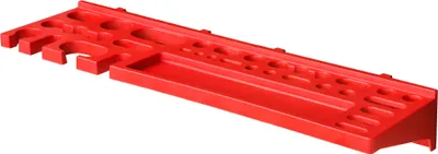 A red plastic tool organizer mounted on a wall.