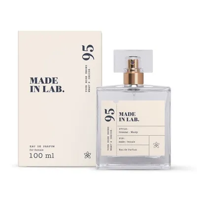 A bottle of perfume and its packaging are displayed against a white background.