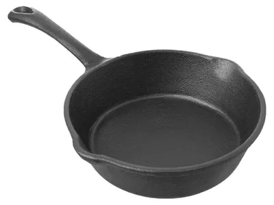 A black cast iron frying pan is shown from a slightly elevated side angle against a white background.