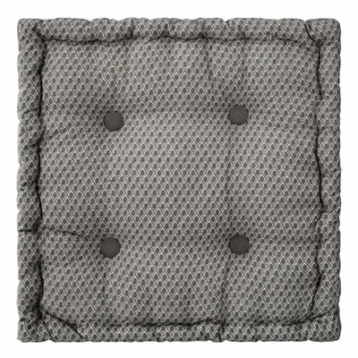 A square floor cushion with a geometric pattern and tufted buttons.