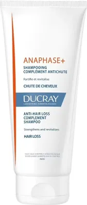 A white tube of Ducray Anaphase+ Anti-Hair Loss Complement Shampoo against a white background.