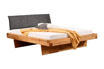 Produktbild von Woodroom Massivholzbett Ypern 140x200 cm – Kiefer massiv eichefarbig geölt, Polsterkopfteil, Holzwange