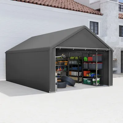 A grey storage tent with shelves filled with various items, parked on a paved surface next to a building.