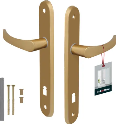 A pair of gold door handles with a product tag attached to one of them, along with some screws and a small grey bar.