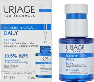 A product shot of a Uriage Bariederm-CICA Daily Serum box and bottle, presented side-by-side against a white background.