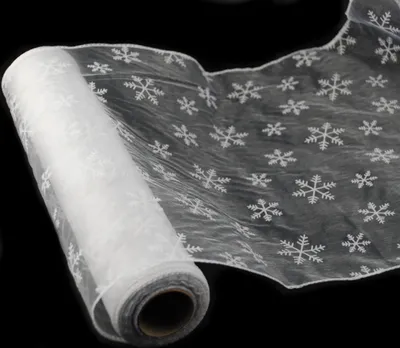 Produktbild von Flocken Organza in weiß 35 cm x 20 m gekettelt mit Schneeflocken