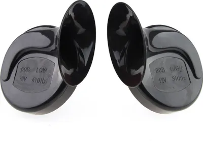 Two black car horns are shown against a white background.