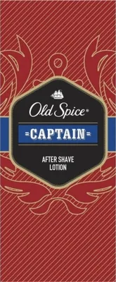 The image is a close-up of the packaging for Old Spice Captain After Shave Lotion, featuring the brand logo and product name.