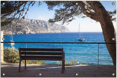 Produktbild von Wallario Outdoor-Poster für Garten oder Balkon, Motiv Einsame Bank am Meer - Spanien im Sommer, in ca. 80 x 120 cm