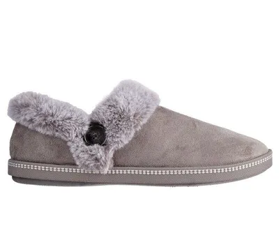 A single gray slipper with faux fur trim and a button detail, shown from the side against a white background.